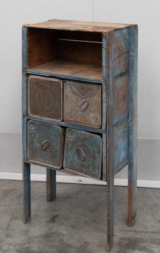 DEPRESSION CHEST: A depression storage chest, made of Shell 'Motor Spirit' and 'ATLANTIC UNION' oil tin cans as drawers; chest measures 116cm high, 53.5cm wide, 37cm deep.