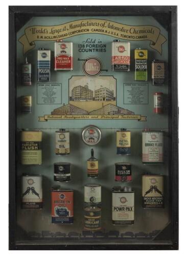 WHIZ AUTOMOTIVE: A superb scarce&nbsp;original Whiz Automotive Products salesman framed store display featuring 22 Whiz tins mounted to pictorial tin advert backing. Measures 126.5cm high, 87.5cm wide.
