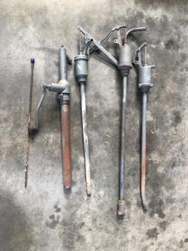 HIGHBOY: A group of four highboy oil pumps including 'Simac',&nbsp;'Malleable Castings' stamped pumps and a dipstick with dark blue cap