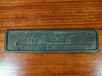 BUGATTI: A brass plaque displaying &lsquo;Ettore Bugatti&rsquo;