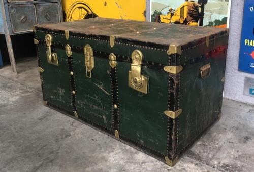 STEAMER TRUNK: A large metal steamer trunk from the 1950s migrant ship "MV Australia" with a &lsquo;Lloyd Thriestino', destination Melbourne&rsquo; luggage label affixed to side, one locking unit detached from base, as per photos