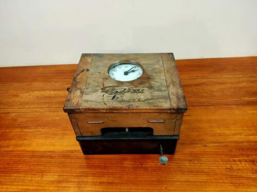 CLOCK: A horizontal tabletop boxed &lsquo;Bundy&rsquo; clock by Glenhill Brook