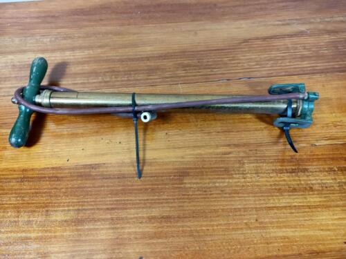 PUMP: An early brass and timber foot pump, circa 1920s/30s