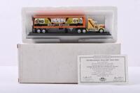 PETERBILT: A MATCHBOX 1:100 scale Peterbilt cab and trailer in 'HARLEY-DAVIDSON' livery (CCY14/HA-M), featuring the original advertisement announcing the 1957 Harley-Davidson Sportster, black and green cab, silver interior, black trailer, model on black s
