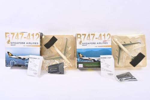 SINGAPORE AIRLINES: Two 1:400 scale Dragon Wings Aircraft Premiere Collection diecast models in 'SINGAPORE AIRLINES - MEGATOP' livery. Boeing B747-412 models