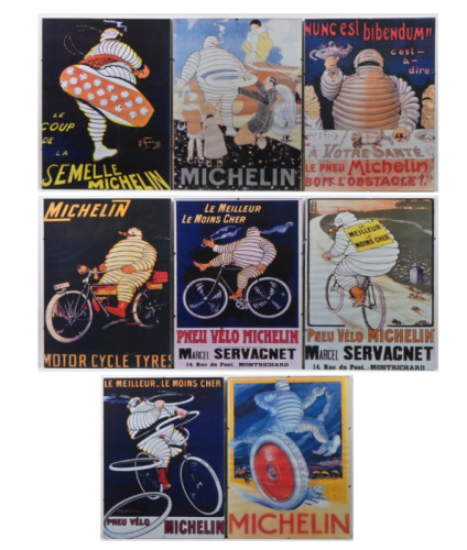 MICHELIN: A selection of eight modern reproduction paper prints of early Michelin Bibendum advertising, mounted to board behind glass.&nbsp;