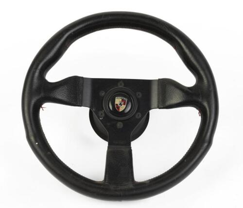 MOMO: An aftermarket Momo steering wheel with Porsche centered horn button, Steering wheel with boss kit.