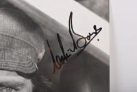 BOND: A black and white image of Colin Bond. Colin Bond signature - 2