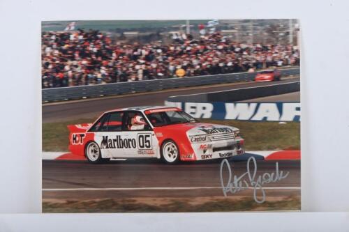 BROCK: A colour image on photographic paper of the HDT VK Holden Commodore as raced by Peter Brock and Larry Perkins at Mt. Panorama, Bathurst. Image signed by Peter Brock