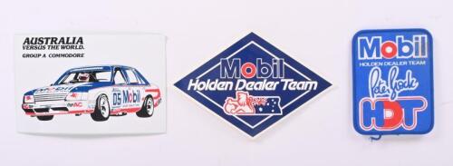 HDT: Three items related to Holden Dealer Team. Cloth 'Mobil HOLDEN DEALER TEAM - Peter Brock HDT' badge & stickers