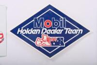 HDT: Three items related to Holden Dealer Team. Cloth 'Mobil HOLDEN DEALER TEAM - Peter Brock HDT' badge & stickers - 3