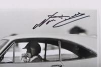 BEECHEY: A black and white image of Norm Beechey driving the HT Monaro. Image signed by Norm Beechey - 2