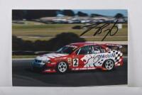BRIGHT: A colour image on photographic paper of Jason Bright in a HSV VX Holden Commodore at Phillip Island. Jason Bright signature