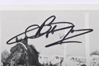 BEECHEY/JANE: A very unusual black and white print depicting Bob Jane and Norm Beechey trying out real horsepower with Trotters at Calder Park Raceway, 1968. Bob Jane & Norm Beechey signatures - 2