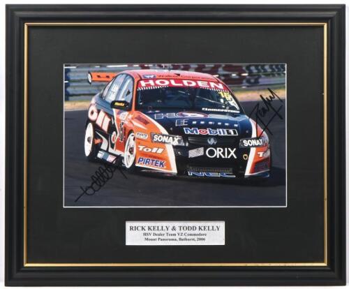 KELLY: A colour image of Rick and Todd Kelly racing the HSV dealer Team VZ Commodore at Mount Panorama, Bathurst, 2006. Rick & Todd Kelly signatures