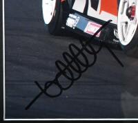 KELLY: A colour image of Rick and Todd Kelly racing the HSV dealer Team VZ Commodore at Mount Panorama, Bathurst, 2006. Rick & Todd Kelly signatures - 3