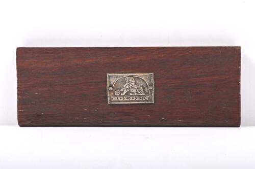HOLDEN: A HOLDEN badge on wooden plaque