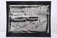 1977 BATHURST: A photographic re-print of of the famous 1-2 form finish by the Moffat Ford Dealers Falcons of Moffat and Bond at Bathurst 1977. Picture signed by Colin Bond, Allan Moffat & Jacky Ickx