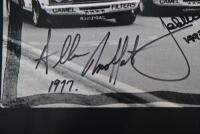 1977 BATHURST: A photographic re-print of of the famous 1-2 form finish by the Moffat Ford Dealers Falcons of Moffat and Bond at Bathurst 1977. Picture signed by Colin Bond, Allan Moffat & Jacky Ickx - 2