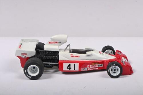 SCHENKEN: A 1:43 scale white metal model of a 1974 Trojan T103 as raced by Tim Schenken. Signed to base by Tim Schenken
