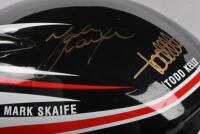 HSV: A Limited Edition racing helmet commemorating HSV's 20 years of V8 racing participation. Helmet signed by 2007 Team drivers - Garth Tander, Rick Kelly, Mark Skaife, Todd Kelly - 5
