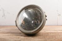 HEAD LAMP: An early electric brass spotlight made by C.A.V