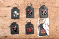 JAGUAR/MG: A collection of six&nbsp;unused enameled key chains including Jaguar & MG&nbsp;