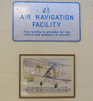 AIRCRAFT: An ‘Air Navigation Facility’ reflective metal sign and poster