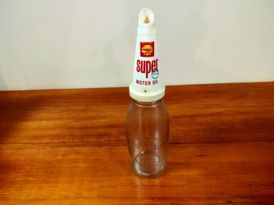 SHELL: A One Imperial Quart Shell embossed glass oil bottle with Super plastic pourer