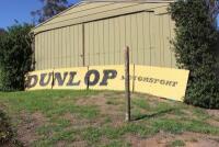 DUNLOP: A large &lsquo;DUNLOP MOTORSPORT&rsquo; tin sign ex- Surfers Paradise International Raceway (740cm wide). - 3