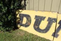DUNLOP: A large &lsquo;DUNLOP MOTORSPORT&rsquo; tin sign ex- Surfers Paradise International Raceway (740cm wide). - 8