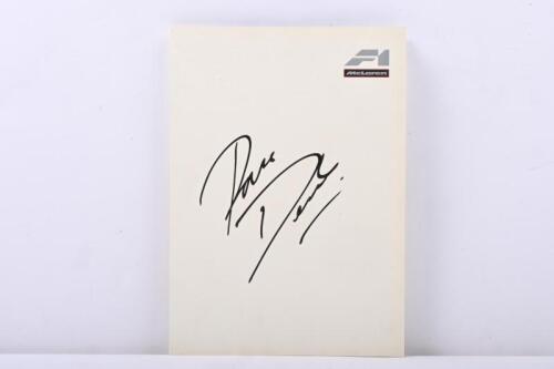 159 · McLAREN: A set of McLaren F1 information sheets. White folder signed by Ron Dennis