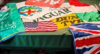 FLAGS: A collection of motoring and national flags including; JAGUAR, DUNLOP TYRES, ALFA ROMEO, TATTERSALLS HISTORIC ETC