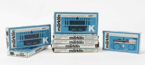 MARKLIN: Seven Marklin 2297 Straight K Electric Uncoupler Track sections together with a 7549 Solenoid Point Motor