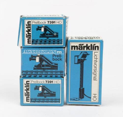 MARKLIN: Three boxed Marklin HO 7391 Prellbocks and a 7236&nbsp;light signal for M and K Track in H0