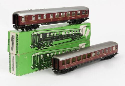 MARKLIN: Two boxed Marklin 4024 express restaurant cars in red German Federal Railways livery