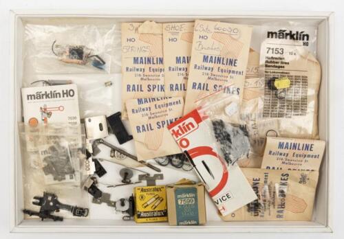 MARKLIN: A collection of Marklin HO spares including two reverse motors, tyres, bushes globes, springs, shoes etc.