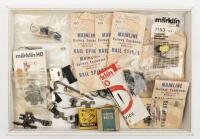 MARKLIN: A collection of Marklin HO spares including two reverse motors, tyres, bushes globes, springs, shoes etc.