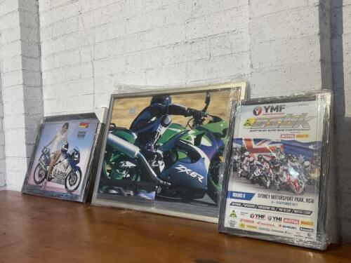 139 · FRAMED PRINTS: A group of three framed prints featuring Yamaha and Kawasaki advertising [Location: Sydney]