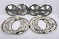 TRIUMPH: 2000. One set of four hubcaps. One set of four slotted wheel trims