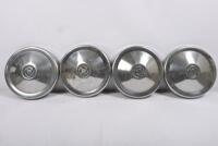 TRIUMPH: 2000. One set of four hubcaps. One set of four slotted wheel trims - 5
