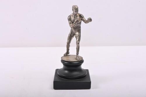 56C · BOXING: A circa 1930s boxing figure/mascot in silver plated metal, mounted on stepped stone base, 18cm high overall