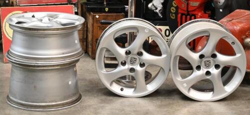 PORSCHE: A set of factory original 996 Porsche 'Turbo Twist' wheel rims, with centre caps, spacers and nuts, rear 18 x 11- 45 O/S, front 18 x 8 - 50 O/S, also believed to be suitable for 993 models. These wheels were removed from a wide body Porsche 964.