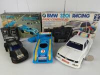 PORSCHE/BMW: Three Porsche and BMW remote control cars, two with original boxes and all with hand controler.&nbsp;