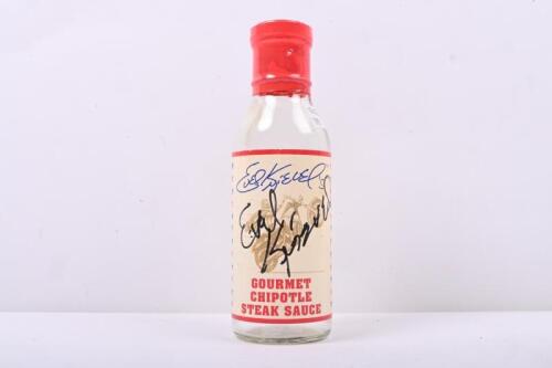 EVEL KNIEVEL: An empty 'Evel Knievel GOURMET CHIPOTLE STEAK SAUCE' bottle with front label hand signed by Evel Knievel