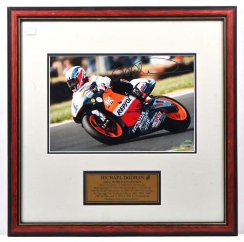 MICK DOOHAN: A numbered autographed photo by AUTOGRAPHED COLLECTIBLES of Mick Doohan in a state of race riding a 500cc Honda NSR 500. Photograph numbered '1396'