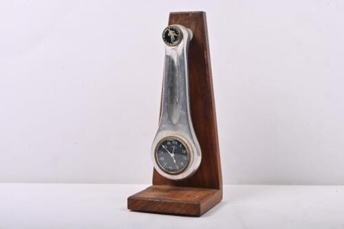 COVENTRY SPEEDWAY: An interesting trophy made from a conrod with Swiss made Swiza clock, mounted to wood. Conventry Speeday emblem to top of conrod. 27cm high.