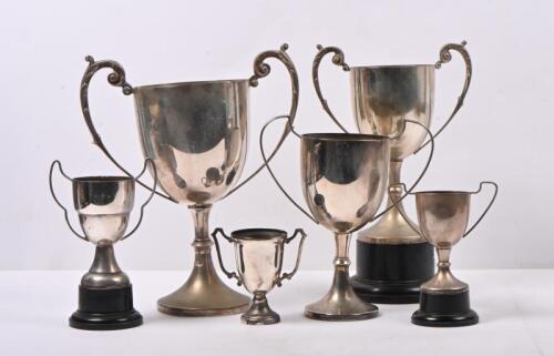 TROPHIES: A collection of six various sized trophies. Largest being 27cm high. Not inscribed.
