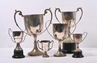 TROPHIES: A collection of six various sized trophies. Largest being 27cm high. Not inscribed.
