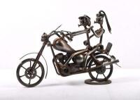 SCULPTURE: A modern motorcycle sculpture made from repurposed nuts, bolts and metal parts